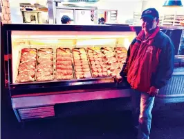  ?? Submitted photo ?? ■ Angel Maldonado, senior meat cutter with Texas Roadhouse, poses at the meat counter at Texas Roadhouse. Maldanado will compete Tuesday for the privilege to cut against the region’s best butchers.