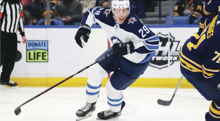  ?? JeffRey T. BaRNeS/THe aSSoCiaTeD PReSS ?? Winnipeg Jets forward Patrik Laine was limited to 10:56 of ice time Sunday against the Buffalo Sabres as he continues to struggle offensivel­y.