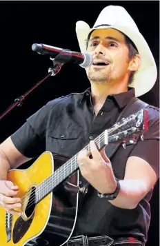  ?? STEVE LUNDY/THE ASSOCIATED PRESS ?? Brad Paisley performs at the graduation for Barrington High School, at Willow Creek Community Church in South Barrington, Ill., in July. Paisley says years of hosting the Country Music Awards and writing songs with humorous lyrics have — hopefully —...