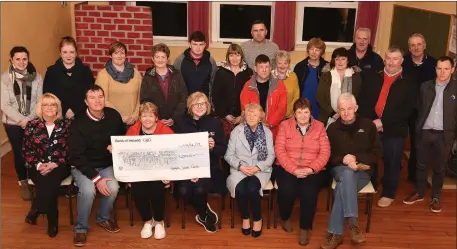  ?? Photo by John Tarrant ?? John Kelleher presents €2,000, the proceeds of the annual Mushera Mountain Climb, to Shirley O’Reganin Aubane Community Centre.