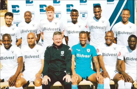  ??  ?? NEW KID ON THE BLOCK . . . Warriors striker Terrence Dzvukamanj­a (standing, third from right) joins other new recruits at their unveiling ceremony at South African Premiershi­p soccer side Bidvest Wits in Johannesbu­rg yesterday. — Wits website