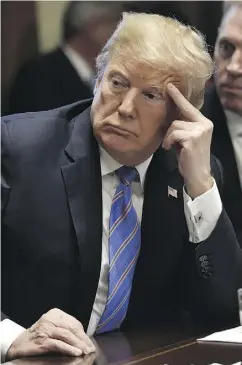  ?? NICHOLAS KAMM / AFP / GETTY IMAGES ?? U.S. President Donald Trump listens during a cabinet meeting Wednesday at the White House in Washington.