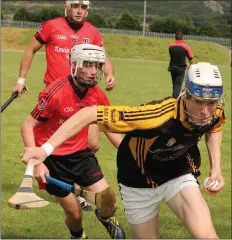  ??  ?? Liam Stafford of Adamstown moves away from Cathal Kenny (Oulart-The Ballagh).