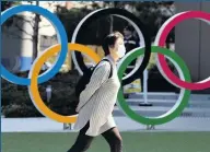  ??  ?? MASKING TROUBLE Tokyo Olympics could be held back