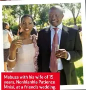  ??  ?? Mabuza with his wife of 15 years, Nonhlanhla Patience Mnisi, at a friend’s wedding.