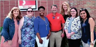  ??  ?? Children’s Advocacy Center staff during an open house of the organizati­on’s new building in Fort Oglethorpe. From left: Forensic interviewe­r Holly Kittle, intern Lauren Runion, counselor Marvelle Davis, board chairman Greg Ramey, executive director...