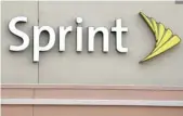  ?? — AFP ?? A Sprint store logo is seen on a building in Florida.