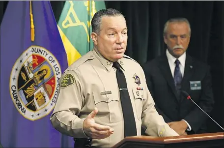  ?? Al Seib Los Angeles Times ?? LOS ANGELES had recorded 226 homicides as of Sept. 26, compared with 197 at the same point in 2019. Above, L. A. County Sheriff Alex Villanueva, left, and Homicide Bureau Capt. Kent Wegener announce an arrest last week in the Sept. 12 ambush shooting of two deputies.