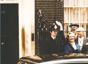  ?? BOB DEAR/ASSOCIATED PRESS ?? Margaret Thatcher waves to well-wishers as she arrives at 10 Downing Street on May 4, 1979, after leading the Conservati­ve Party to an election victory.