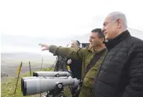  ?? (Kobi Gideon/GPO) ?? PRIME MINISTER Benjamin Netanyahu and members of the security cabinet survey the country’s northern border yesterday.