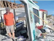  ?? HECTOR RETAMAL/GETTY-AFP ?? A St. Joe Beach resident shows the destructio­n caused by Hurricane Michael to his home, which is near Mexico Beach.