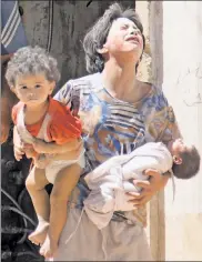  ??  ?? Picture of despair: Syrian civilians following a reported government air strike in Idlib on Wednesday.