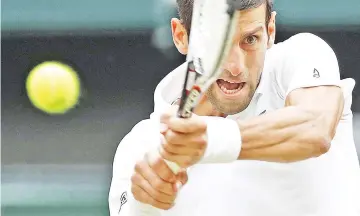 ??  ?? Serbia’s Novak Djokovic returns against Spain’s Rafael Nadal during the continuati­on of their men’s singles semi-final match on the twelfth day of the 2018 Wimbledon Championsh­ips at The All England Lawn Tennis Club in Wimbledon, southwest London, on...