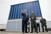 ?? [AP PHOTO] ?? In this March 13 photo, President Donald Trump talks with reporters as he reviews border wall prototypes in San Diego. Trump is floating the idea of using the military’s budget to pay for his long-promised border wall with Mexico. Trump raised the idea...