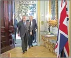  ?? JACK HILL/AFP ?? US Secretary of State Rex Tillerson (left) and Britain’s Foreign Secretary Boris Johnson arrive for a press conference in central London on Monday.