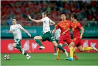  ?? AP ?? Gareth Bale (second from left) and Harry Wilson (left) fight for the ball against China’s Wang Shenchao and He Guan. —