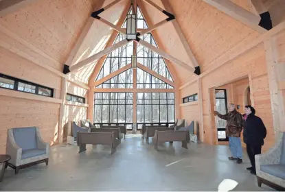  ?? MIKE DE SISTI / MILWAUKEE JOURNAL SENTINEL ?? Michael Murry (left) and Susan Rabe stand inside the Conservanc­y for Healing and Heritage’s newly constructe­d chapel in Franklin.