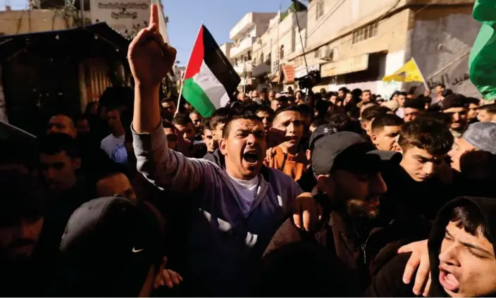  ?? Photograph: Hazem Bader/AFP/Getty Images ?? Mourners on Tuesday attending the funeral procession of two men killed in an Israeli army incursion in the al-Fawwar refugee camp on the West Bank.