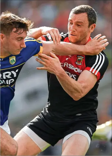  ??  ?? NO WAY
THROUGH: Keith Higgins of Mayo holds up Kerry substitute James O’Donoghue at Croke Park