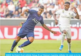  ??  ?? MUNICH: Real Madrid’s Brazil midfielder Rodrygo (R) and Tottenham’s Argentinia­n midfielder Erik Lamela vie for the ball during the Audi Cup football match between Real Madrid and Tottenham Hotspur. — AFP