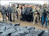  ?? REUTERS ?? (Left-right) Bodies laid on the ground after a rocket attack at a train station in Kramatorsk; European Commission president Ursula von der Leyen (centre) in Bucha.