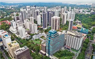  ??  ?? Market recovers: A file picture showing residentia­l buildings in the Orchard Road area of Singapore. The property market has shown signs of a turnaround this year. — Bloomberg