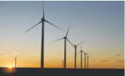  ?? Bloomberg file ?? Among Colorado’s turbines that produce electricit­y are shown above near Lamar. Tax credits for wind farms could be affected by tax reform.