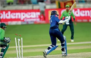  ?? All Photos by Shihab ?? Pakistan’s Fakhar Zaman is clean bowled by Sri Lanka’s Dananjaya, while Upul Tharanga is cleaned up by Mohammed Hafeez during the first One-Day Internatio­nal in Dubai on Friday. —