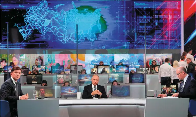  ??  ?? Russian President Vladimir Putin holds his annual televised phone-in with the nation in Moscow. Photo: Getty Images