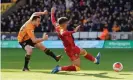  ??  ?? Jota scores the opening goal. Photograph: Andrew Yates/Reuters