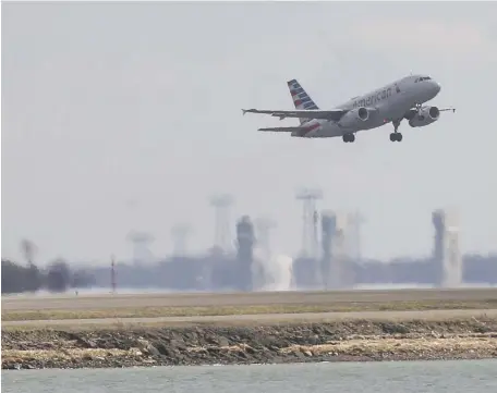  ?? NICOLAuS CzARnECkI / HERALD STAFF ?? WE CAN FLY! An American Airlines flight takes off from Logan Airport on Friday.