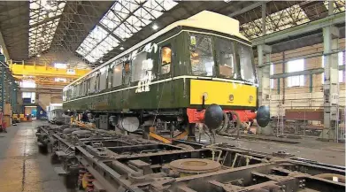  ?? PAUL CLIFTON. ?? A Class 117 driving vehicle inside Eastleigh Works. Its bogies have yet to be fitted, and can be seen next to the DMU.