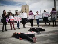  ?? (Hadas Parush/Flash90) ?? WOMEN PROTEST violence against women, outside the Prime Minister’s Office in Jerusalem yesterday.