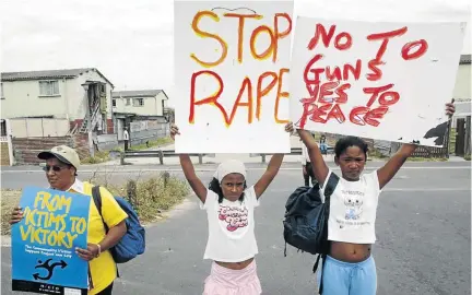  ?? /ESA ALEXANDER ?? Parents and children in Hanover Park, Cape Town, protesting against violence and the abuse of women and children in their community.