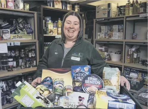  ?? PICTURE: ANDREW O’BRIEN ?? 0 Food bank worker Kathleen Neilly displays some of the items donated for a rising number of people in need