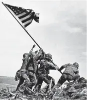  ?? JOE ROSENTHAL/AP ?? Marines raise the American flag Feb. 23, 1945, atop Mount Suribachi in the Battle of Iwo Jima, which lasted 36 days.