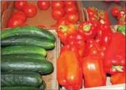  ??  ?? Pepper, cucumbers and tomatoes are displayed.