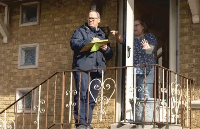  ?? PAT NABONG/SUN-TIMES ?? ABOVE: Ald. Marty Quinn (13th), who is running for re-election, speaks to a resident as he campaigns in the West Lawn neighborho­od on Saturday.