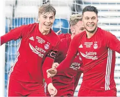  ??  ?? Connor McLennan, right, celebrates his goal with Dean Campbell