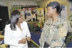  ??  ?? Petal James (left) head of mortgage sales, JN Bank, converses with Major Taraja Jackson, during the opening ceremony for Engineers’ Week 2018 at the Knutsford Court Hotel in New Kingston, yesterday.