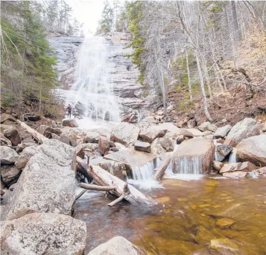  ??  ?? The Arethusa Falls in New Hampshire’s White Mountains. Across the U.S., a glorious array of waterfalls awaits nature lovers.
CALEB KENNA/THE NEW YORK TIMES