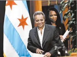  ?? BRIAN CASSELLA/CHICAGO TRIBUNE ?? Mayor Lori Lightfoot arrives with CPS CEO Janice Jackson to make a statement about the Chicago Teachers Union strike on Oct. 29 at City Hall.