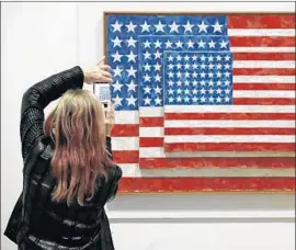  ?? Allen J. Schaben Los Angeles Times ?? “THREE FLAGS” at the Broad. Flags are among artist Jasper Johns’ motifs.