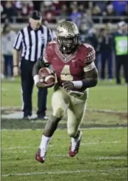  ?? THE ASSOCIATED PRESS FILE ?? According to columnist Bob Grotz, the Eagles’ gutsiest move at No. 14 in the NFL Draft would be to select Florida State running back Dalvin Cook — a superior talent with shoulder and off-the-field issues.