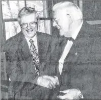  ?? SUBMITTED PHOTO ?? Frank Pigot, left, is shown receiving the Prince Edward Island Museum and Heritage Foundation Meritoriou­s Achievemen­t Award from former Lt.-Gov. Gilbert Clements. Pigot’s “A History of Mount Stewart” was first published in 1975.