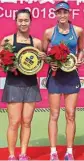  ??  ?? Karman Kaur Thandi and Chinese player Xinyun Han with their Runner-up and winner trophy respective­ly during $25000 ITF event, in China on Sunday