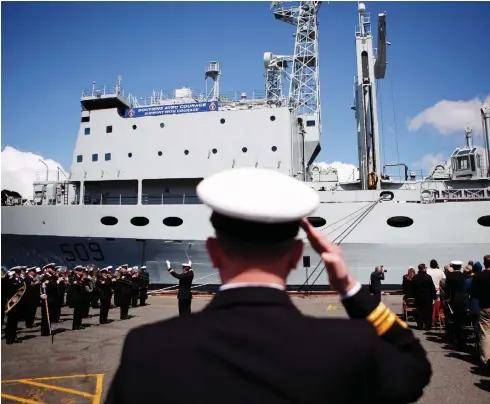  ?? CHAD HIPOLITO / THE CANADIAN PRESS FILES ?? Naval officers are seen for HMCS Protecteur’s paying-off ceremony in 2015. The navy is reportedly at least 10 per cent short of trained sailors.