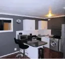  ??  ?? The kitchen in the furnished one-bedroom apartment in the gated Bay Ridge, Milnerton, complex.