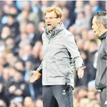  ?? — AFP photo ?? Liverpool’s German manager Jurgen Klopp reacts during the UEFA Champions League second leg quarter-final football match between Manchester City and Liverpool, at the Etihad Stadium in Manchester, north west England on April 10, 2018.