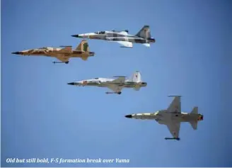  ??  ?? Old but still bold, F-5 formation break over Yuma